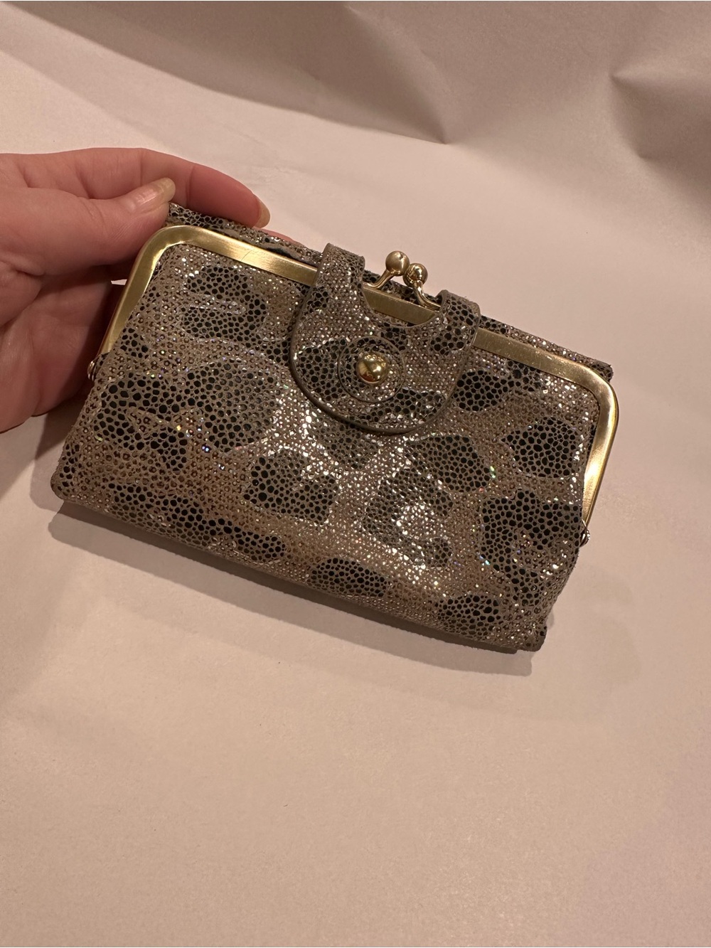 HOBO Leather Holographic and Black Wallet with Gold Accents Kiss-lock closure